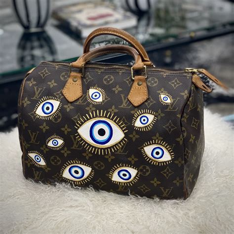 louis vuitton evil eye bag|louis vuitton football player.